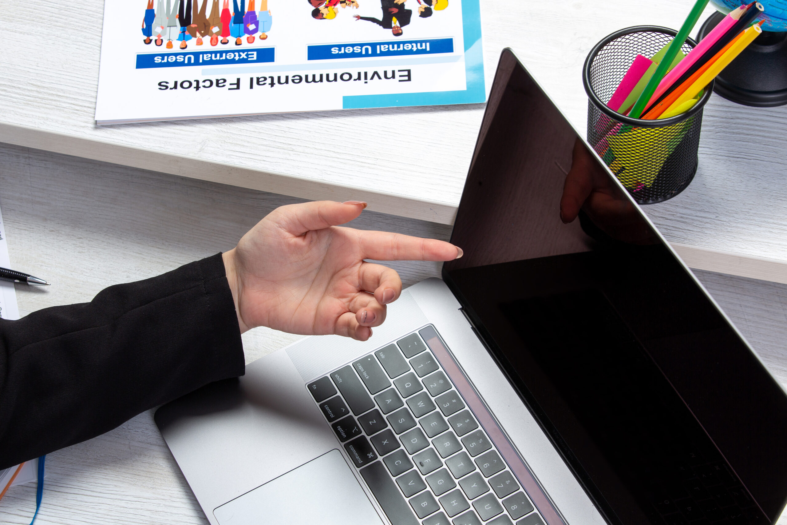 front view girl using laptop front table with schedules graphics using laptop job business activity scaled