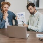 job colleagues working laptop